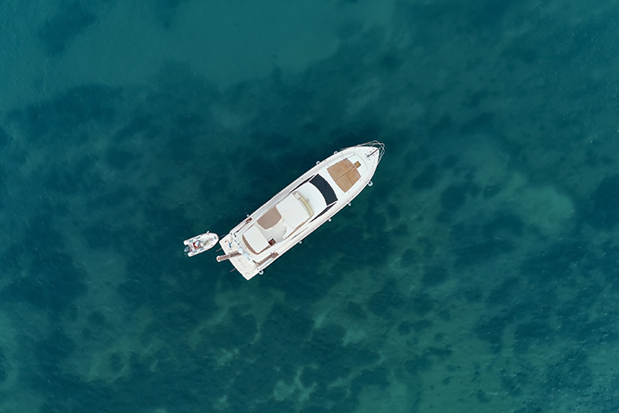 Aerial view on the sea and boat. Beautiful natural seascape at the summer time